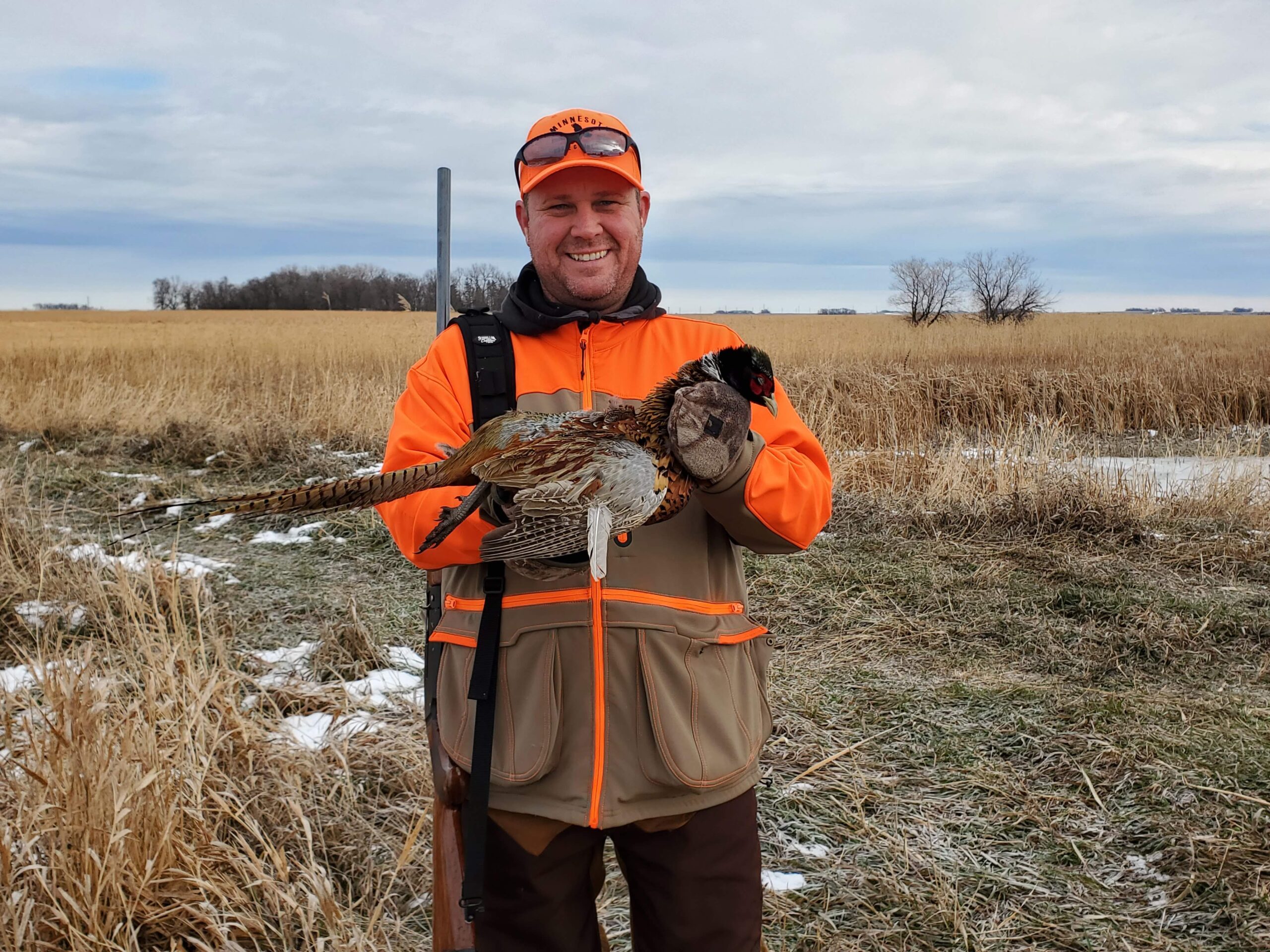 Me holding a successfully harvested pheasant!